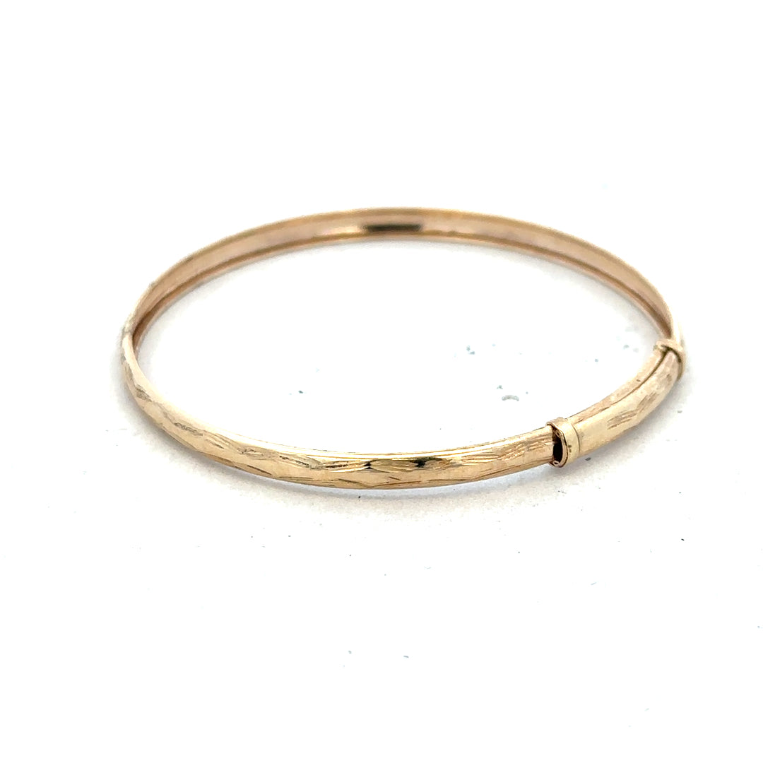 9ct yellow gold bangle, lightweight jewelry accessory with a smooth polished finish, unbranded, 1.7 grams.