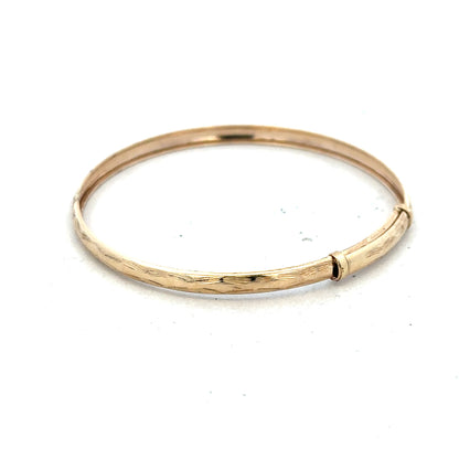 9ct yellow gold bangle, lightweight jewelry accessory with a smooth polished finish, unbranded, 1.7 grams.