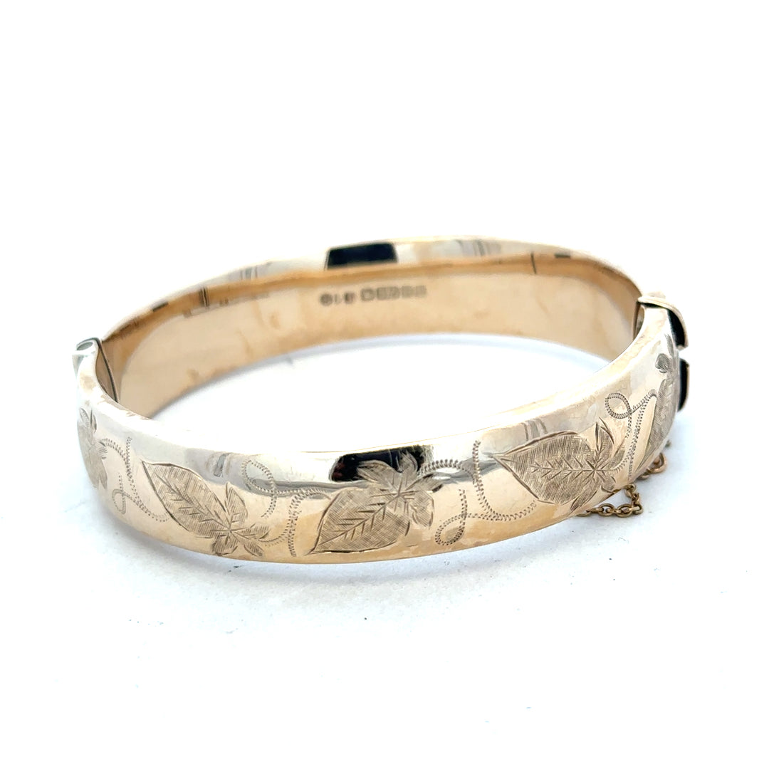 9ct yellow gold bangle weighing 20.3g, unbranded jewelry accessory with a smooth, polished finish.