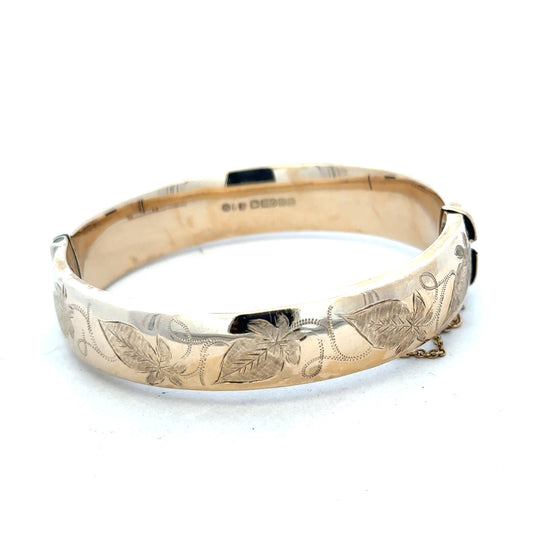 9ct yellow gold bangle weighing 20.3g, unbranded jewelry accessory with a smooth, polished finish.