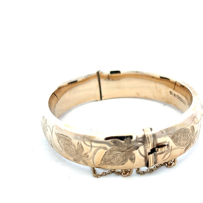 9ct yellow gold bangle weighing 20.3g, unbranded jewelry piece with a smooth, polished finish, displayed on a neutral background.