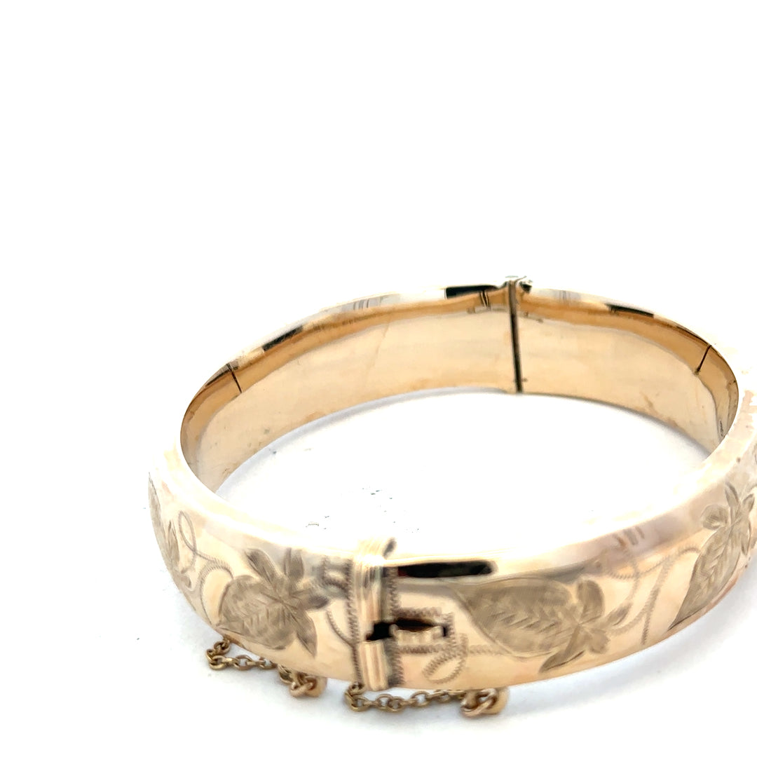 9ct yellow gold bangle weighing 20.3g, unbranded jewelry accessory with a smooth, polished finish.