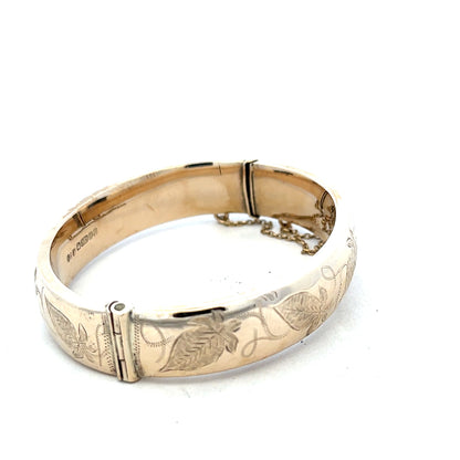 9ct yellow gold bangle with a smooth, polished finish, weighing 20.3 grams, designed for elegant wrist wear.