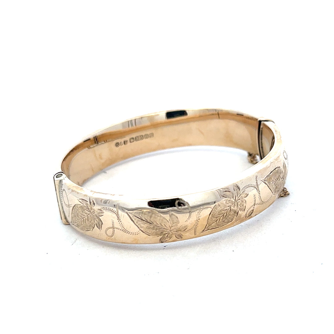 9ct yellow gold bangle with a smooth finish, weighing 20.3g, perfect for elegant jewelry collection.