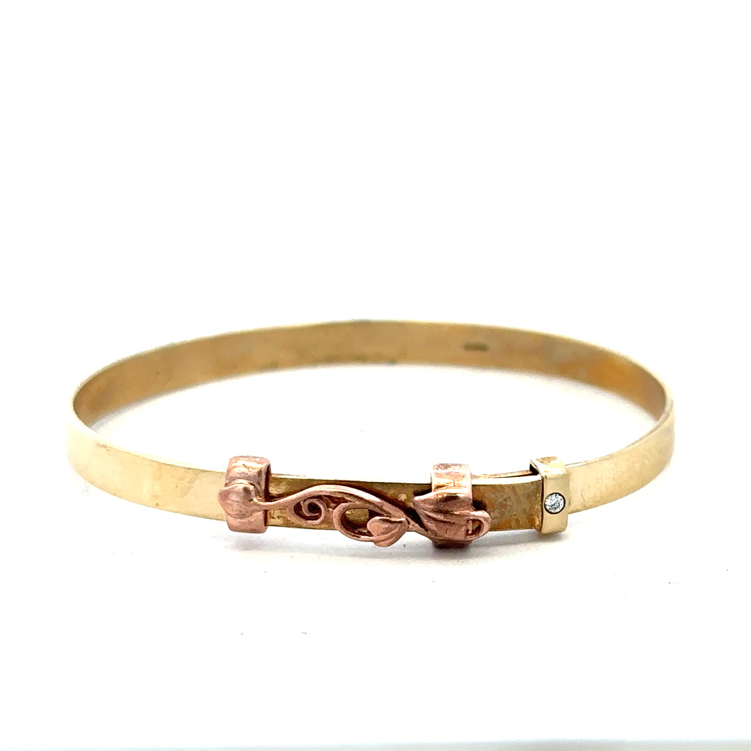 9ct yellow gold bangle weighing 6.3g, unbranded, with a smooth, polished finish shown on a white background.