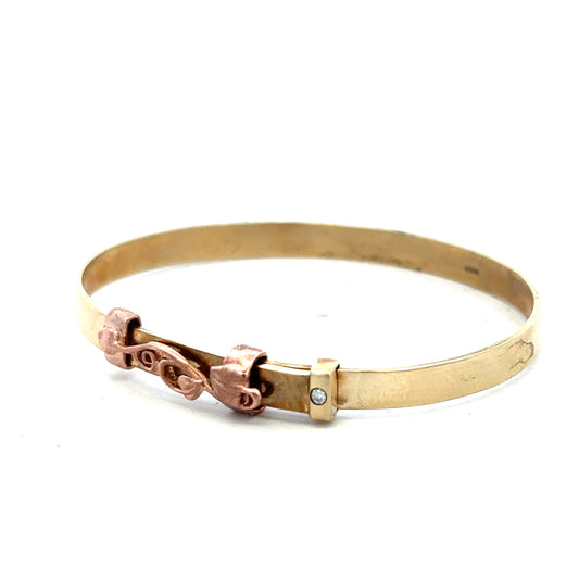 9ct yellow gold bangle weighing 6.3g, unbranded, with a smooth, polished finish and simple circular design.