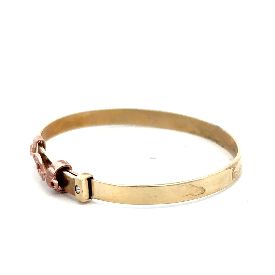 9ct yellow gold bangle, unbranded, lightweight jewelry with a smooth finish, shown from a side view.