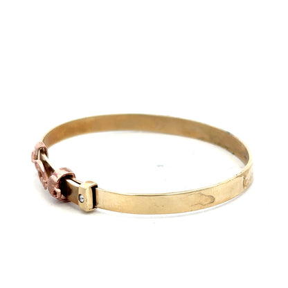 9ct yellow gold bangle, unbranded, lightweight jewelry with a smooth finish, shown from a side view.
