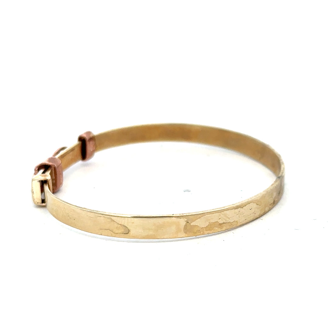 9ct yellow gold bangle weighing 6.3g, unbranded jewelry accessory with a sleek, polished finish.