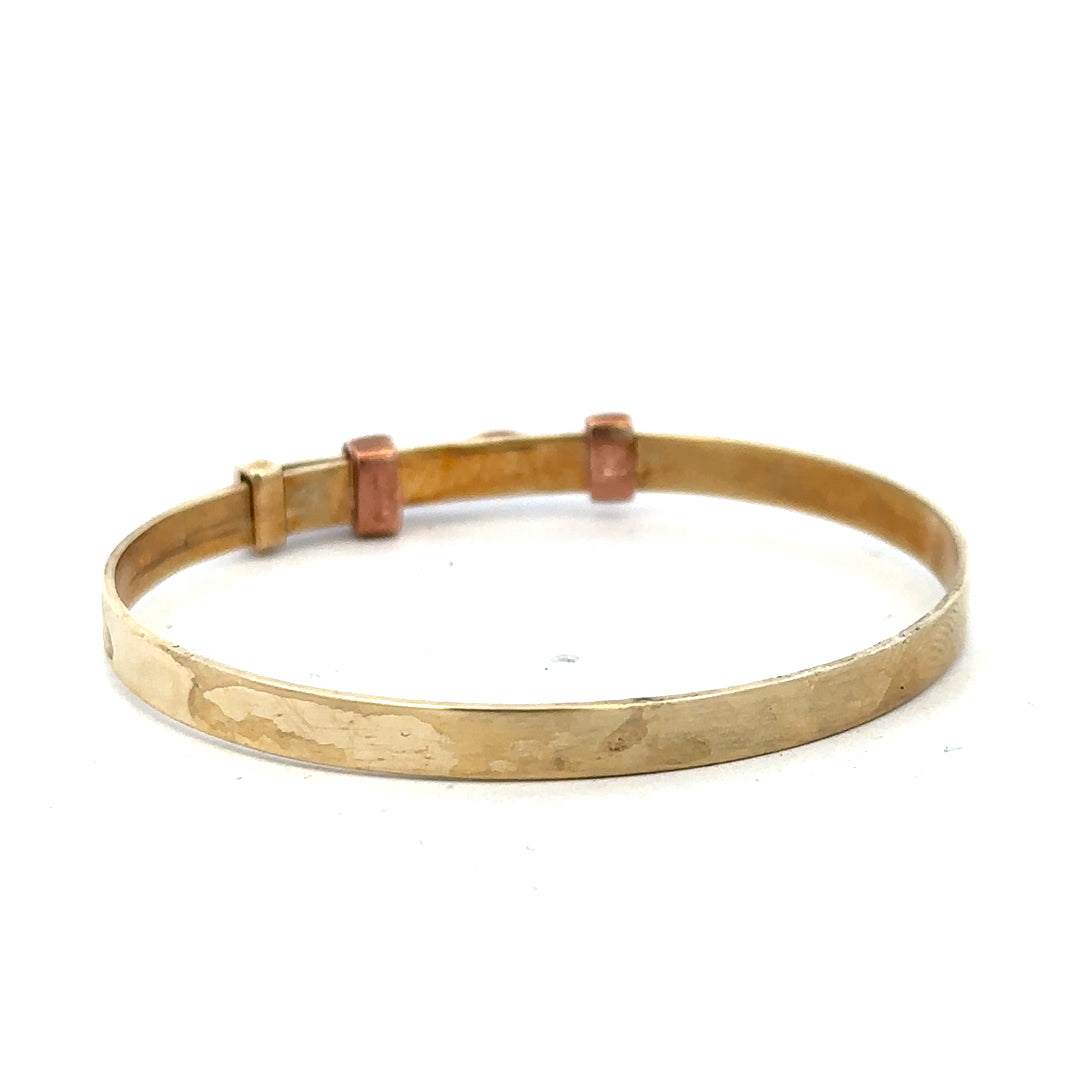 9ct yellow gold bangle, unbranded, 6.3g, smooth and polished jewelry accessory with a simple, elegant design.