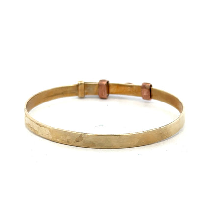 9ct yellow gold bangle weighing 6.3g, unbranded jewelry accessory with a smooth, polished finish.