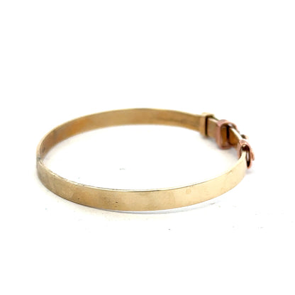 9ct yellow gold bangle weighing 6.3g, stylish unbranded jewelry bracelet with a sleek, polished finish.