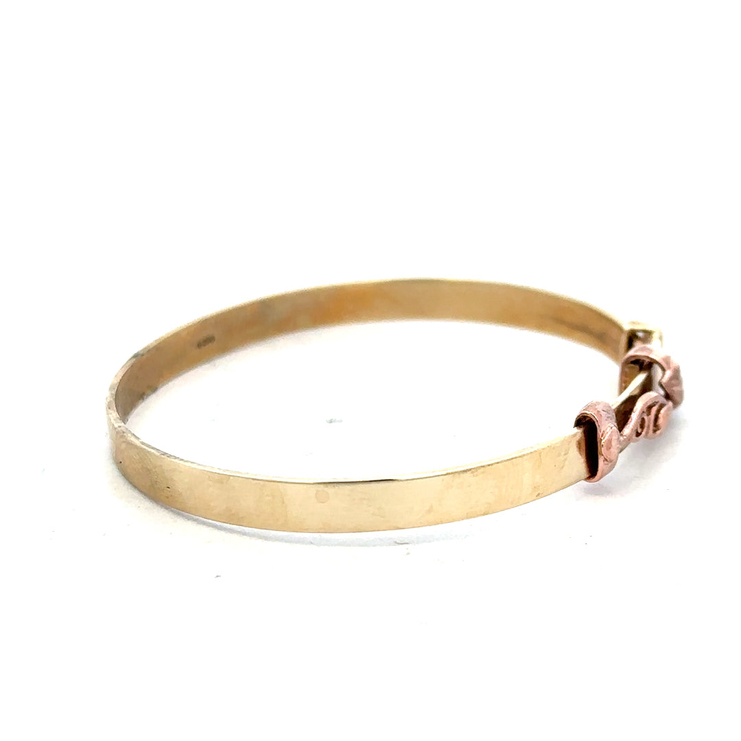9ct yellow gold bangle weighing 6.3g, unbranded jewelry accessory with a smooth, polished finish on a plain background.