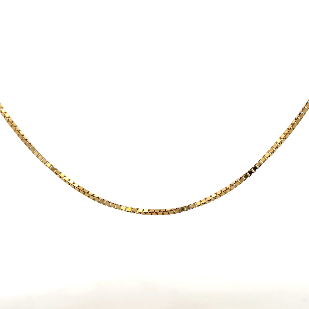 9ct yellow gold box chain weighing 6.4g, unbranded jewelry with a sleek link design, photographed on a white background.