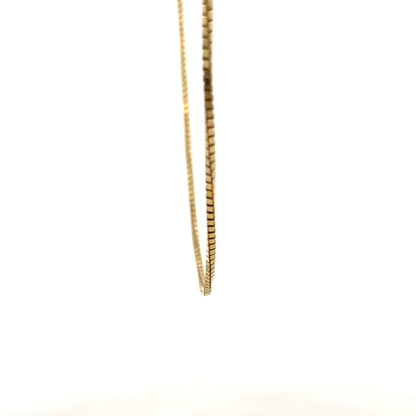 9ct yellow gold box chain weighing 6.4g, unbranded jewelry with a polished finish, close-up of the chain's links.