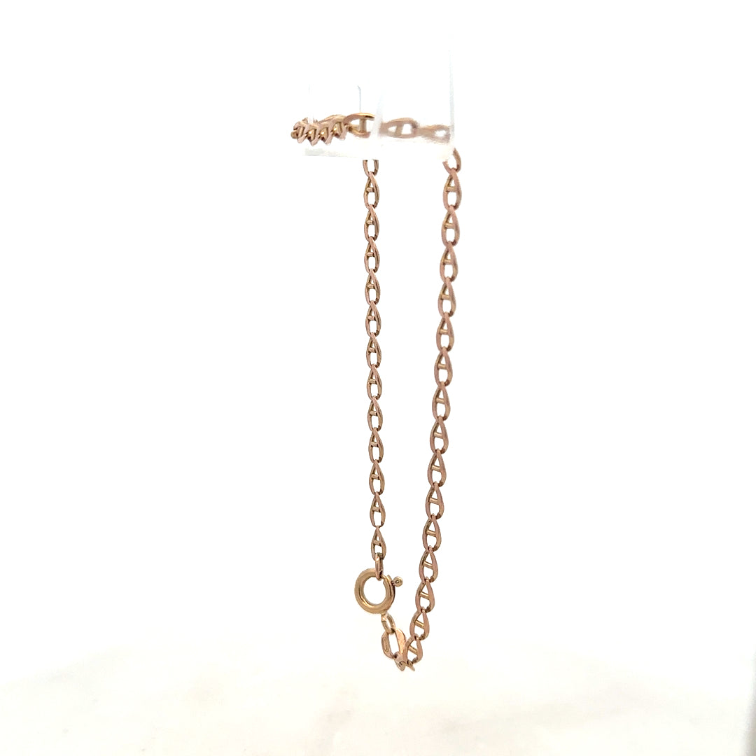 9ct yellow gold bracelet weighing 2.6g, featuring a sleek chain design, unbranded jewelry piece with polished finish.