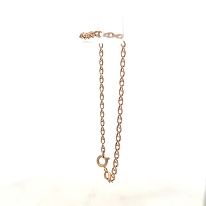 9ct yellow gold bracelet weighing 2.6g, featuring a sleek chain design, unbranded jewelry piece with polished finish.