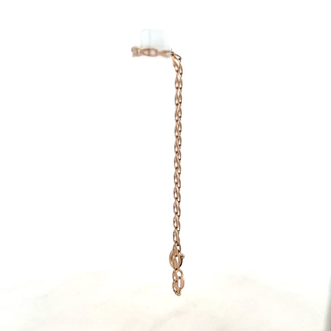 9ct yellow gold bracelet weighing 2.6g, featuring a sleek chain design, unbranded jewelry visible in the image.