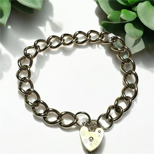 9ct yellow gold bracelet weighing 26.3 grams, featuring a classic chain design, unbranded jewelry accessory.