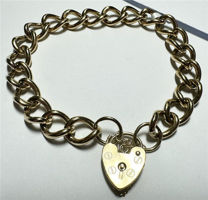 9ct yellow gold bracelet weighing 26.3g, featuring a classic design, unbranded jewelry piece with intricate detailing.