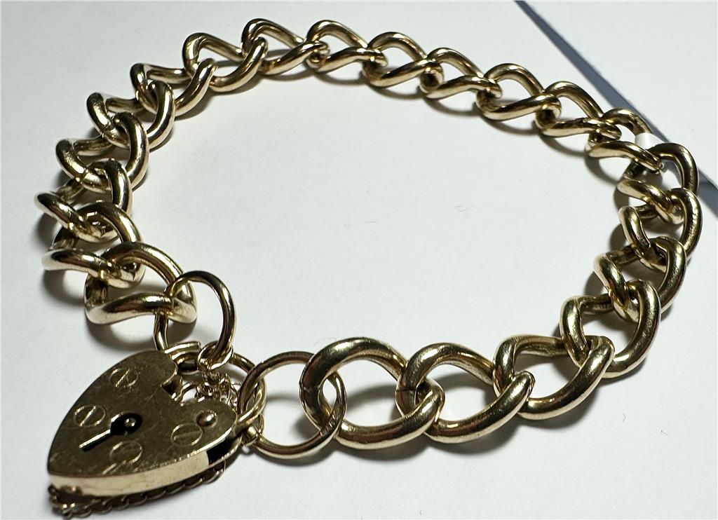 9ct yellow gold bracelet weighing 26.3 grams, featuring a classic chain design, unbranded jewelry piece for women or men.