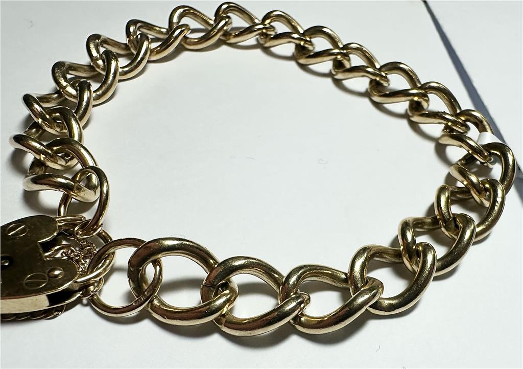 9ct yellow gold bracelet weighing 26.3 grams, featuring a classic design with smooth links, unbranded jewelry accessory.