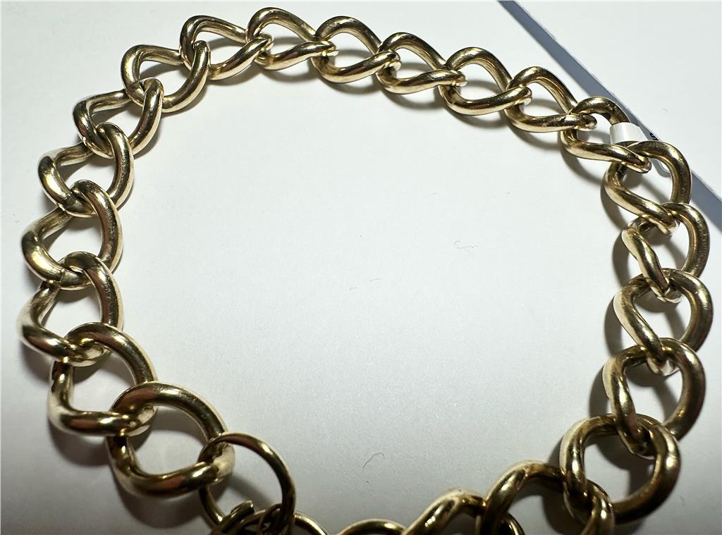 9ct yellow gold bracelet weighing 26.3 grams, featuring a classic linked design, unbranded jewelry displayed on a neutral background.