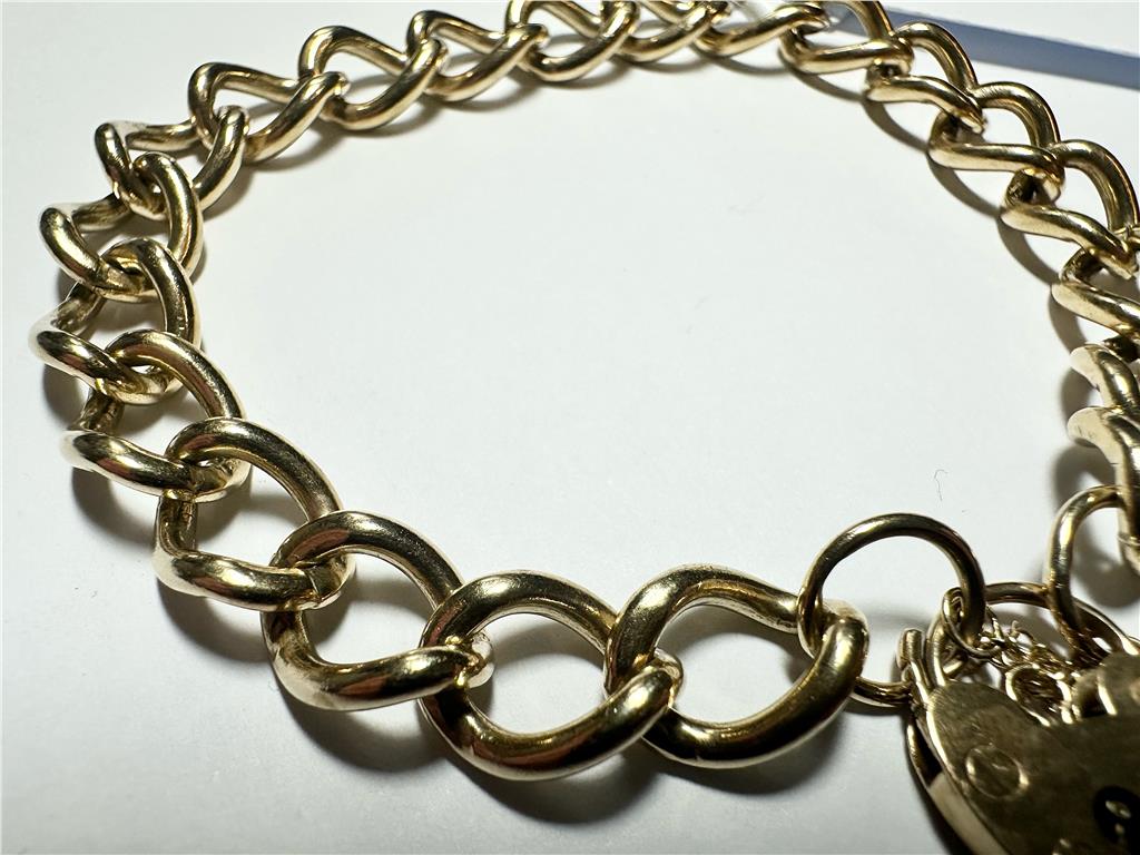 9ct yellow gold bracelet weighing 26.3 grams, unbranded jewelry piece with intricate design and polished finish.