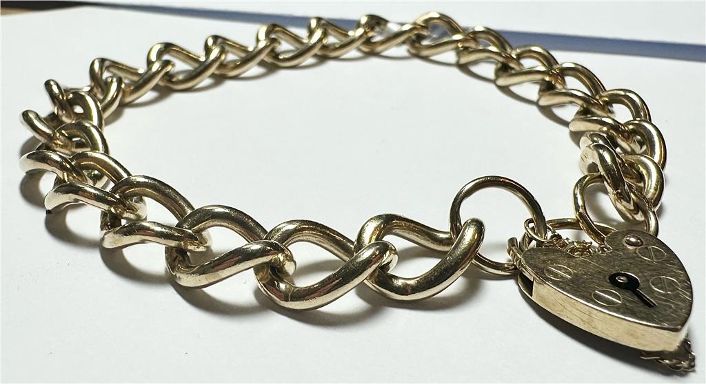 9ct yellow gold bracelet with intricate link design, weighing 26.3 grams, displayed in a close-up image.