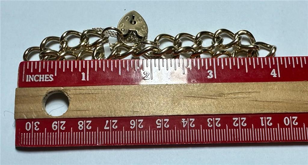 9ct yellow gold bracelet weighing 26.3 grams, unbranded, showcasing a smooth and polished gold jewelry design.