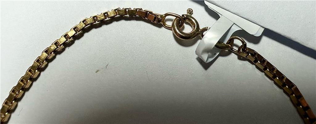 9ct yellow gold bracelet weighing 3.7g, featuring a sleek design, shown in a close-up image highlighting its polished finish.