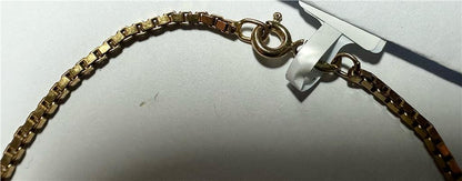 9ct yellow gold bracelet weighing 3.7g, featuring a sleek design, shown in a close-up image highlighting its polished finish.