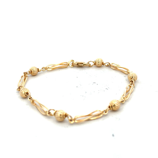 9ct yellow gold bracelet weighing 5.3g, unbranded, with a classic link design, displayed on a plain background.