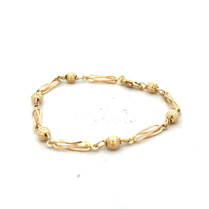 9ct yellow gold bracelet weighing 5.3g with a sleek design, shown in a clear image highlighting its elegant craftsmanship.