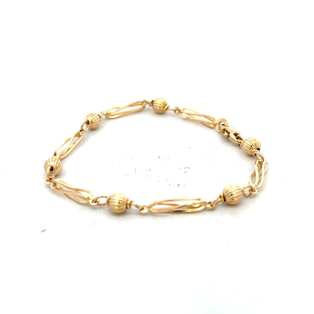 9ct yellow gold bracelet weighing 5.3g, featuring a sleek design, displayed on a neutral background, unbranded jewelry accessory