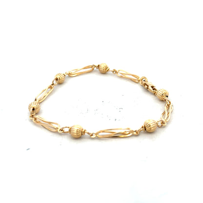 9ct yellow gold bracelet weighing 5.3g, featuring a sleek design, displayed on a neutral background, unbranded jewelry accessory