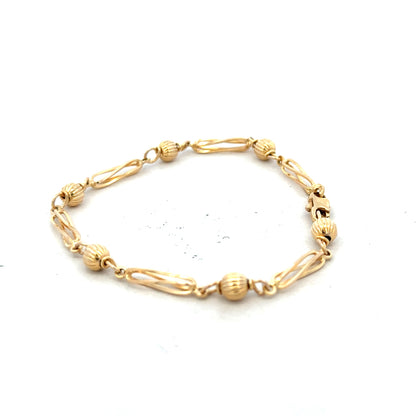 9ct yellow gold bracelet weighing 5.3g, unbranded, with a sleek, polished design, shown on a plain background.