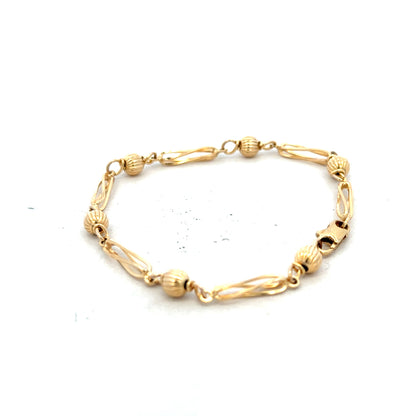9ct yellow gold bracelet weighing 5.3g, featuring a delicate chain design, unbranded jewelry accessory with a polished finish.