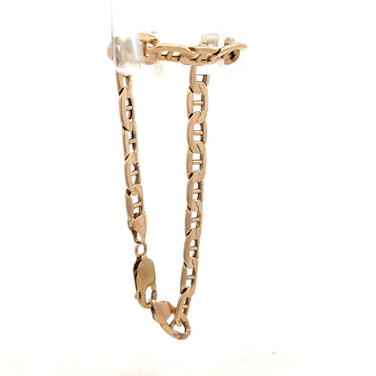 9ct yellow gold bracelet weighing 8.6g, featuring a sleek chain design, unbranded jewelry accessory with a polished finish.