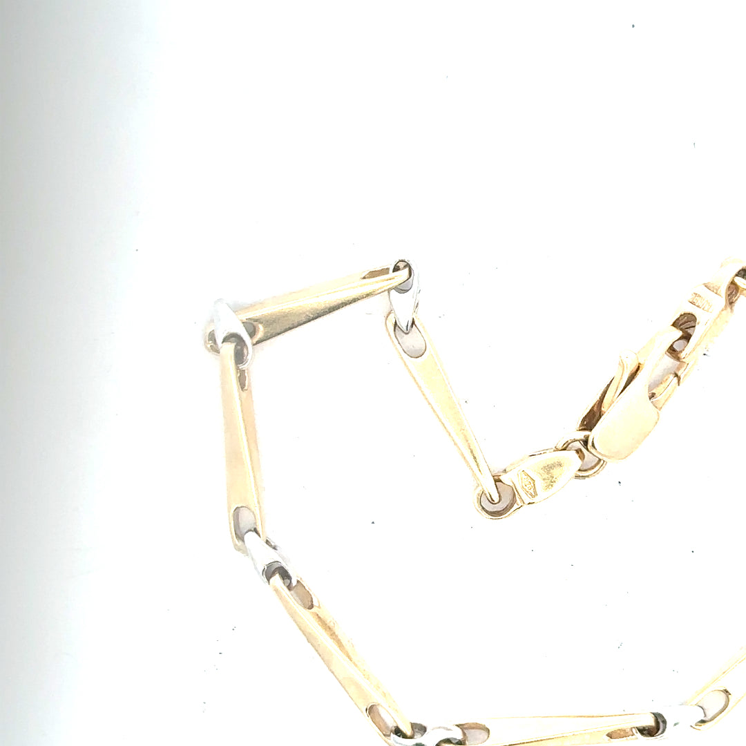 9ct yellow gold bracelet weighing 8.9g, featuring a delicate chain design, displayed on a neutral background.