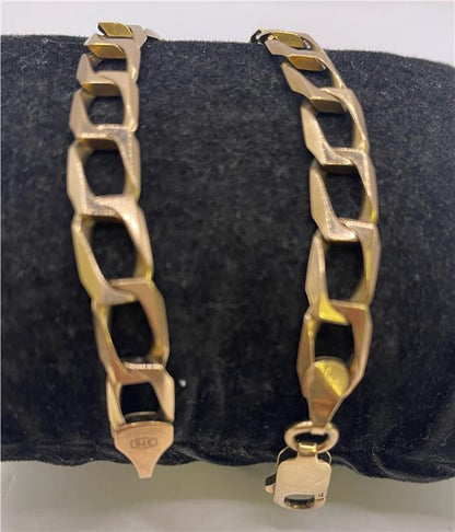 9ct yellow gold bracelet with a delicate chain and clasp, showcasing fine craftsmanship and elegant design.