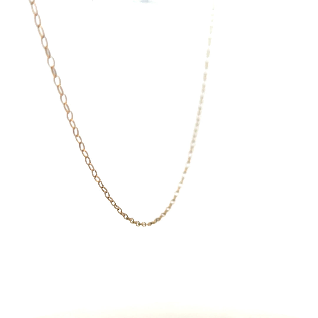 9ct yellow gold chain weighing 0.7g, displayed close-up showing its delicate link design and polished finish.