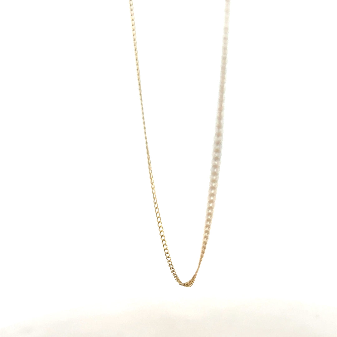 9ct yellow gold chain weighing 1.3g, unbranded, with a classic link design, shown laying flat against a neutral background.