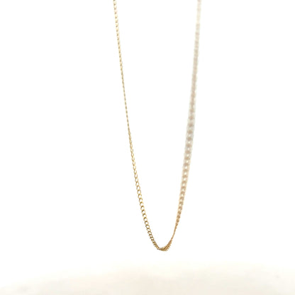 9ct yellow gold chain weighing 1.3g, unbranded, with a classic link design, shown laying flat against a neutral background.