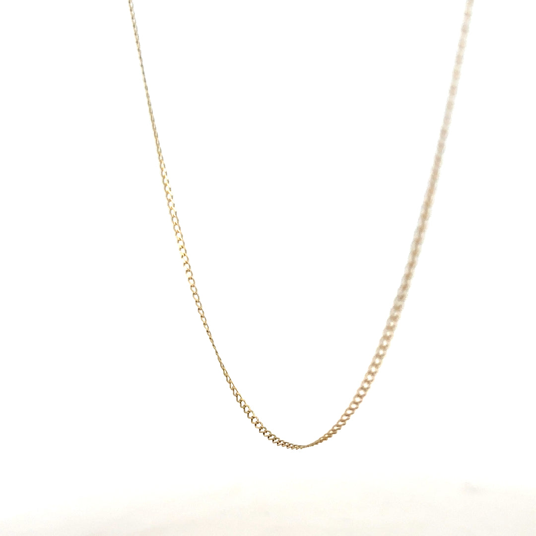 9ct yellow gold chain weighing 1.3g, showcasing a delicate and polished jewelry piece with a classic design and secure clasp.