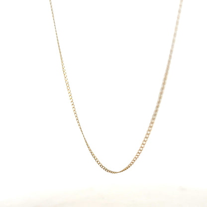 9ct yellow gold chain weighing 1.3g, showcasing a delicate and polished jewelry piece with a classic design and secure clasp.