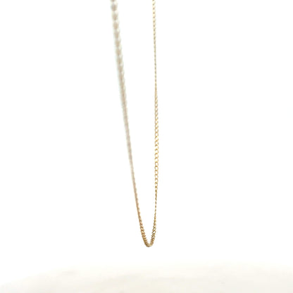 9ct yellow gold chain weighing 1.3g, showcasing a delicate jewelry piece with a smooth link design.