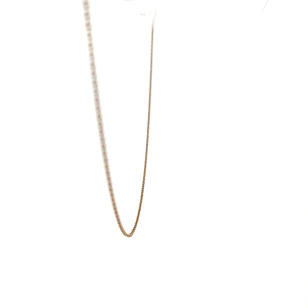 9ct yellow gold chain weighing 1.3g, showcasing a delicate and elegant jewelry design with a secure clasp.