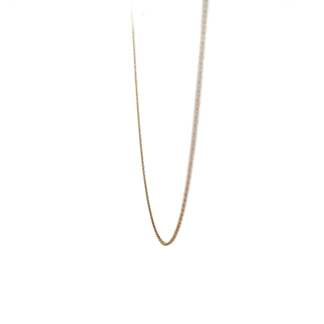 9ct yellow gold chain weighing 1.3g, unbranded jewelry with a classic link design, shown in a detailed product image