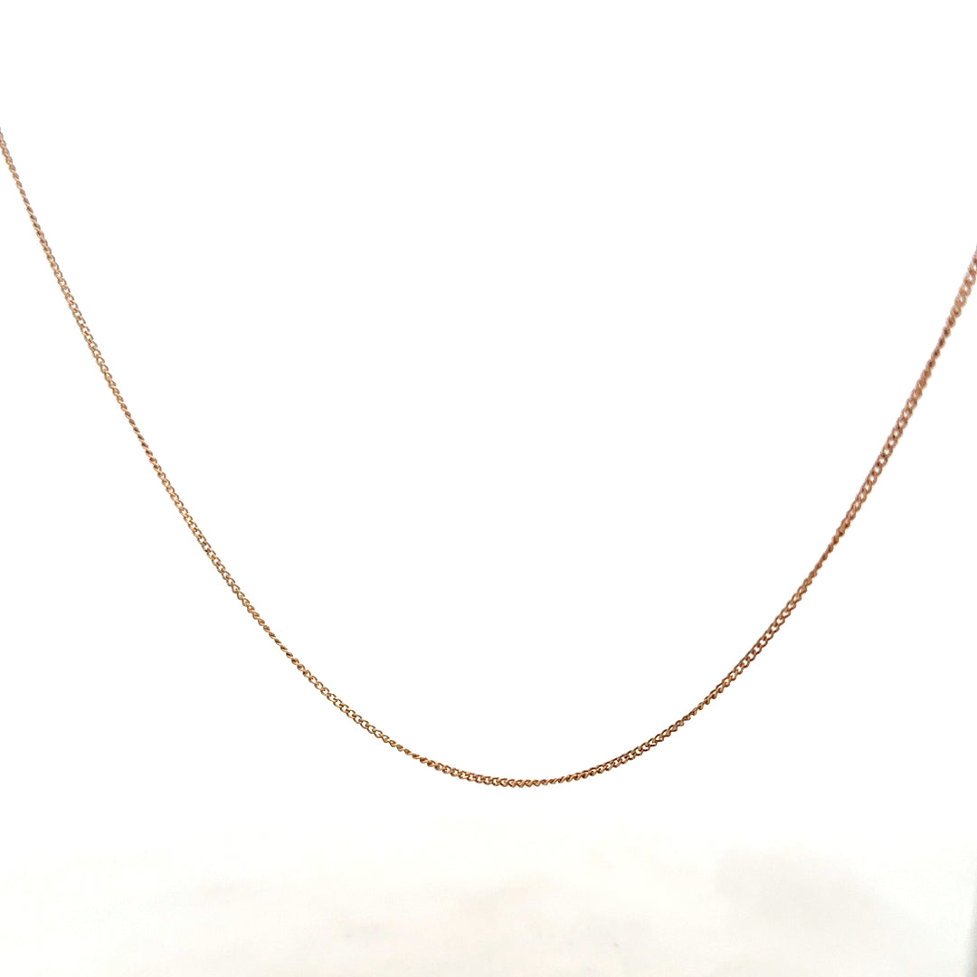 9ct yellow gold chain weighing 1.4g, unbranded jewelry accessory with a delicate design, shown in close-up image.